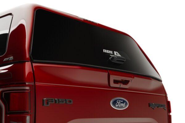 ARE CX REVO TRUCK CAP ON FORD F150 RAPTOR RED REAR DOOR CLOSED CLOSE UP