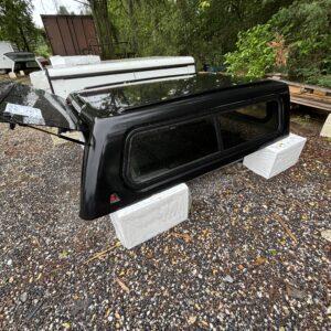 USED LEER 100XR TRUCK CAP 2016 TOYOTA TACOMA SHORT BED EXTENDED CAB - RXF TEXTURED BLACK - 24638941