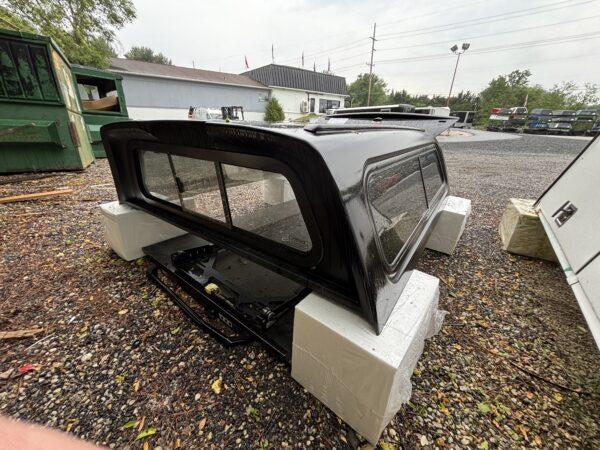 USED LEER 100XR TRUCK CAP 2016 TOYOTA TACOMA SHORT BED EXTENDED CAB - RXF TEXTURED BLACK - 24638941